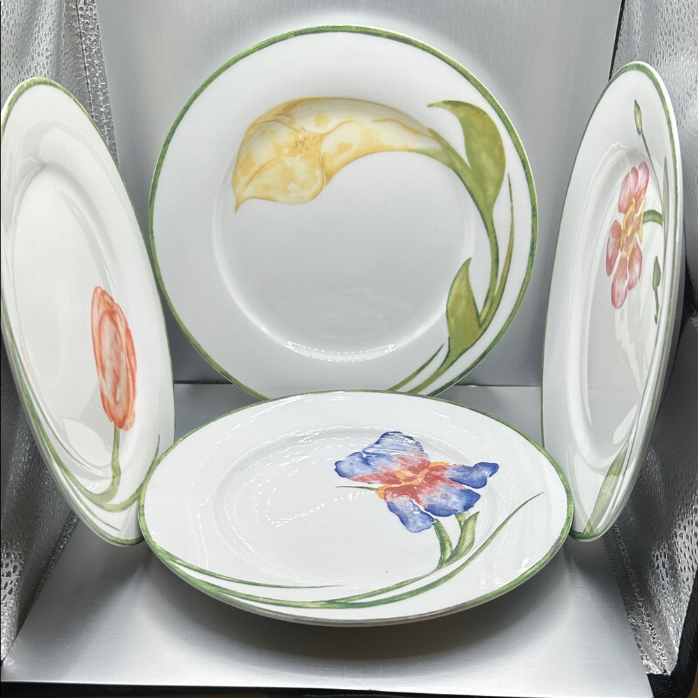 Set of four 7-1/2” plates from Pier 1. NWOT. Four different flowers represented